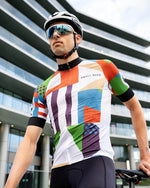 Male cyclist wearing the Small Beer x Paria cycling jersey for men